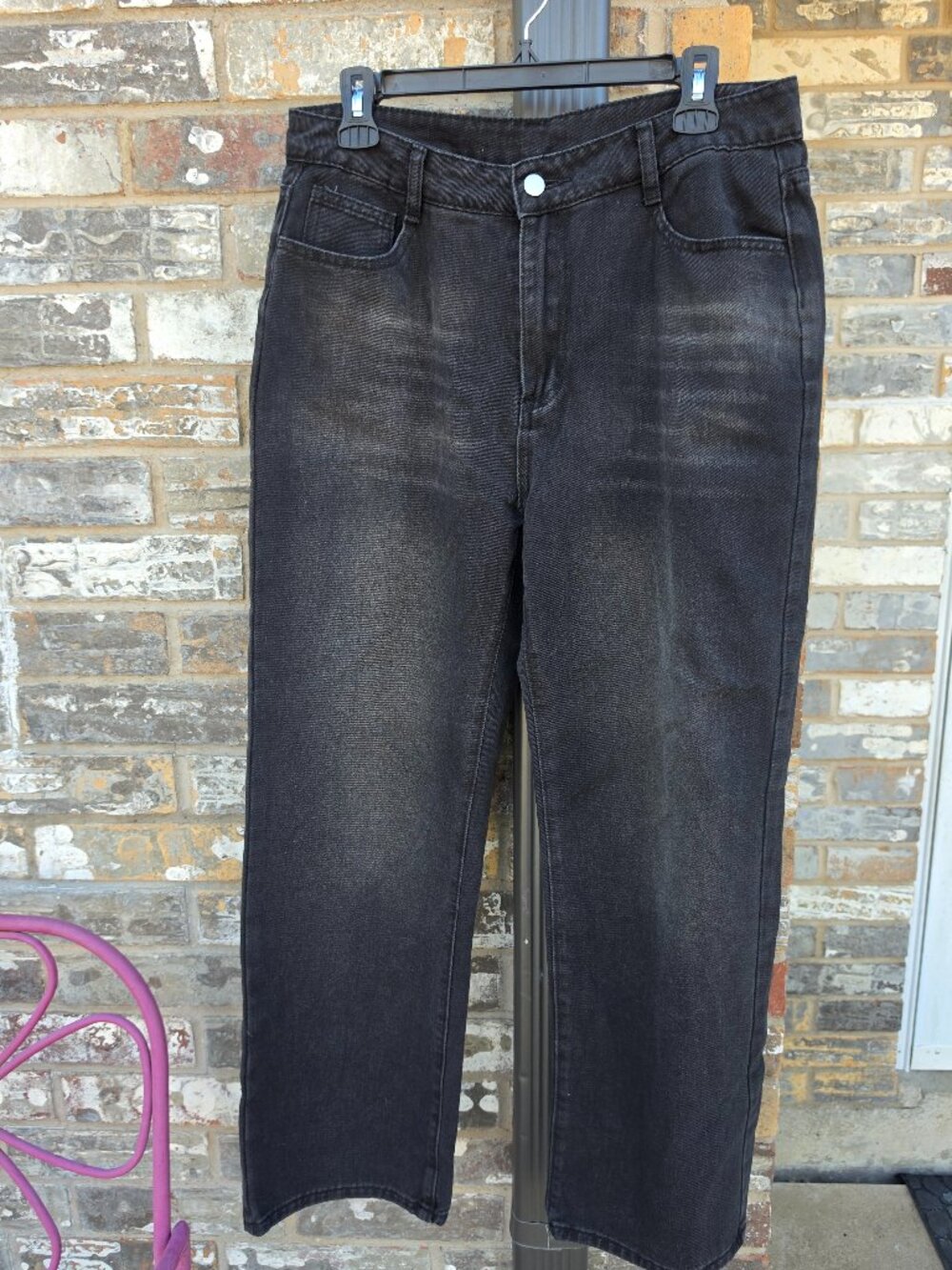 Black washed straight-leg jeans in women’s size L.